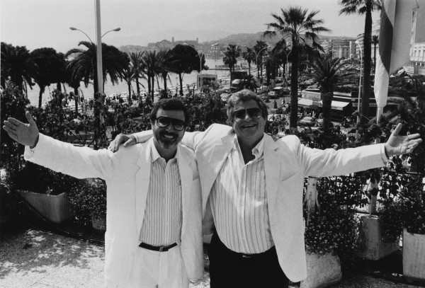 Israel film producers and directors Yoram Globus (left) and Menahem Golan, owners of Cannon Films, at the Cannes Film Festival, France, circa 1987. (Photo by Richard Blanshard/Getty Images)
